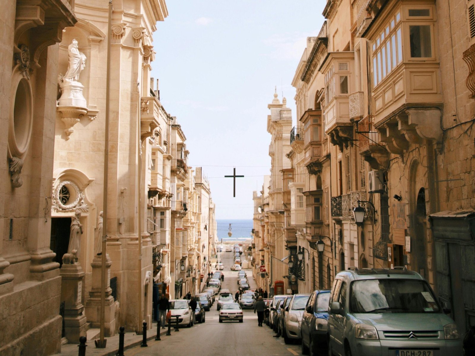 Cars driving down a street in Valletta Malta